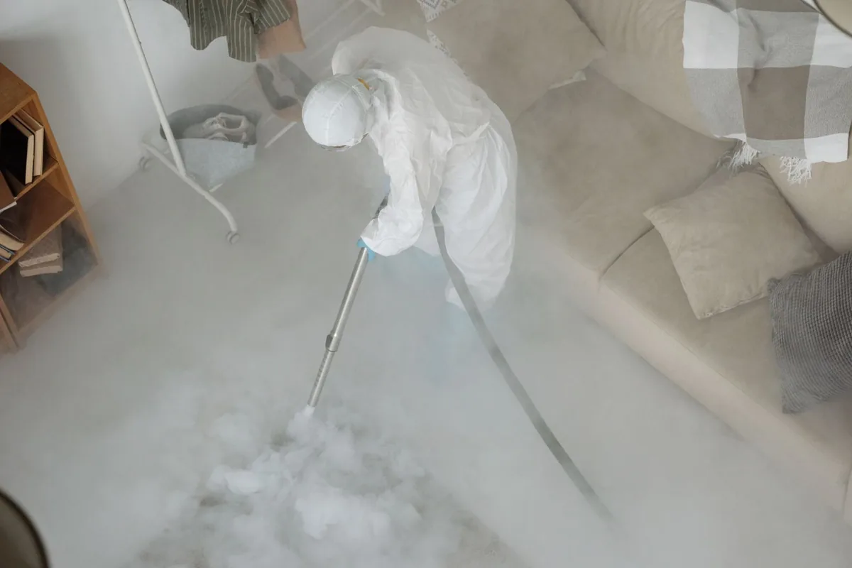 Biohazard cleanup technician in protective equipment, Hanceville, AL